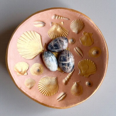 pedra da lua negra e laranja surya cristais