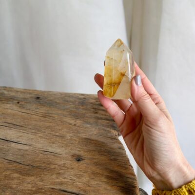 ponta de quartzo hematoide dourado surya cristais